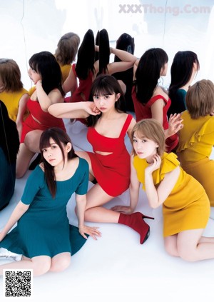 A group of young women in red and yellow dresses.